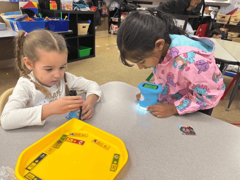 Toddlers using classroom microscopes during hands-on learning at Bright Beginners Academy Bensalem