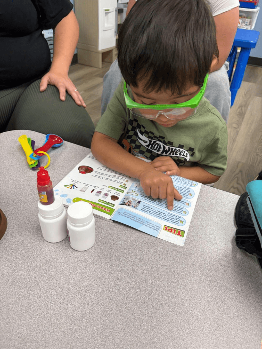 A camper exploring a hands-on volcano science activity during summer camp at Bright Beginners Academy Bensalem.