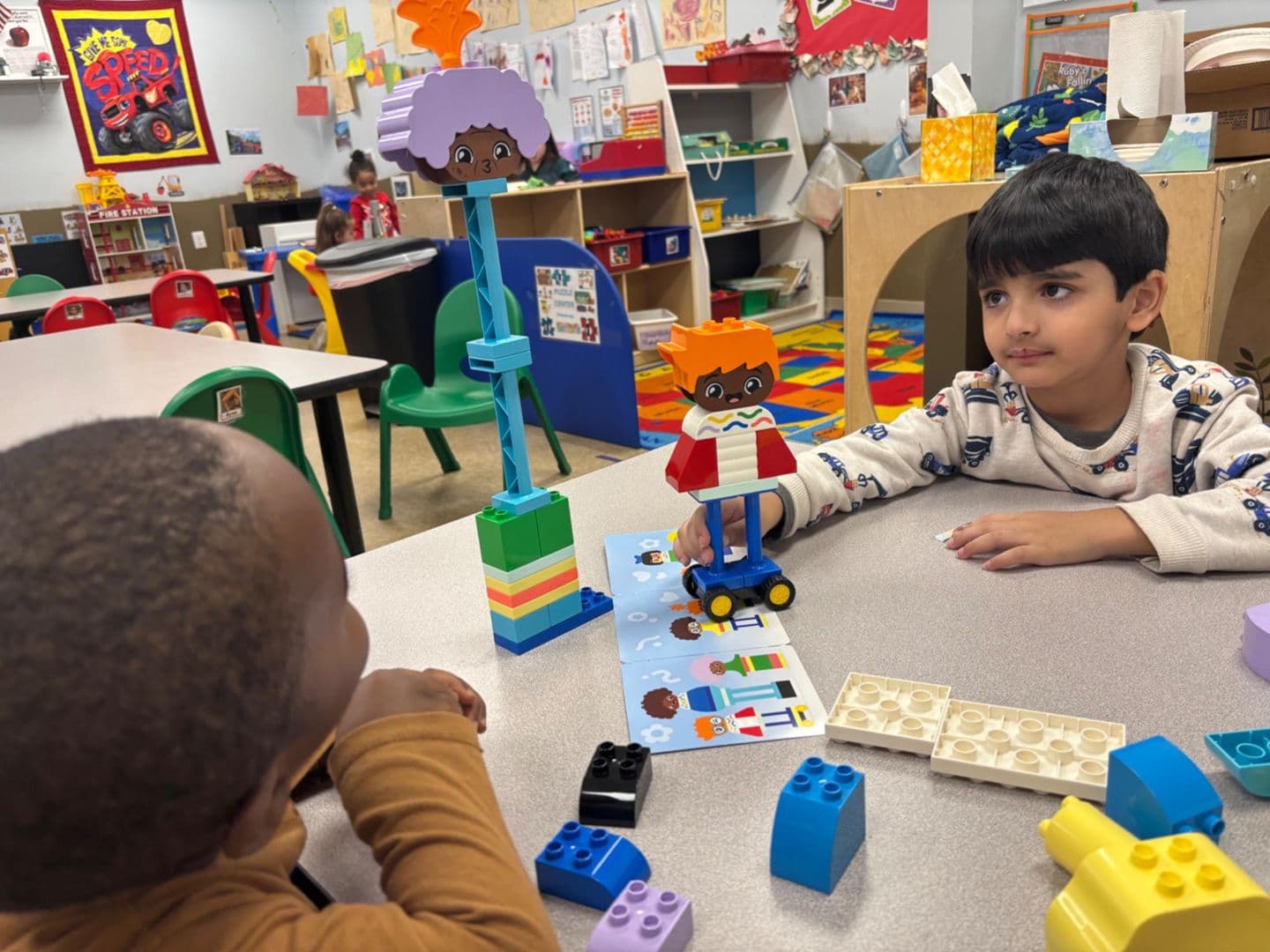 Preschoolers building together with colorful blocks at Bright Beginners Academy Bensalem
