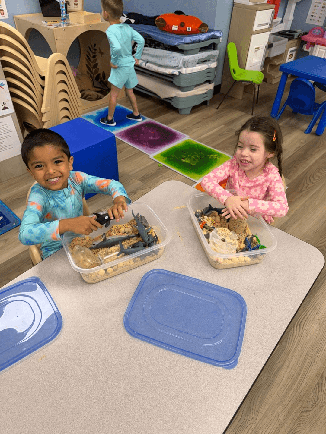 Toddlers exploring sensory bins together at Bright Beginners Academy Bensalem