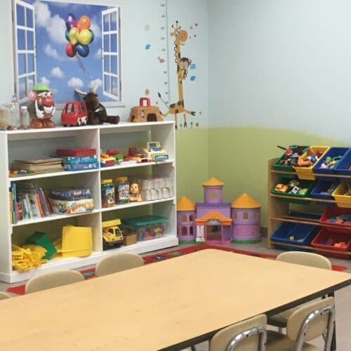 Preschool classroom with learning materials and bright decor